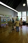 Families view exhibit panels about the history of Palisades.